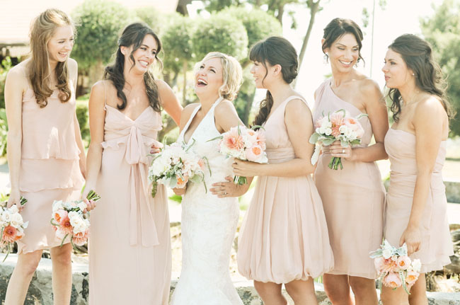 bridesmaids in pink dresses rustic wedding decor