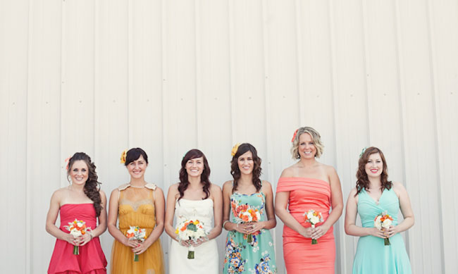 bridesmaids in peach blue and yellow Each bridesmaid picked out their own 